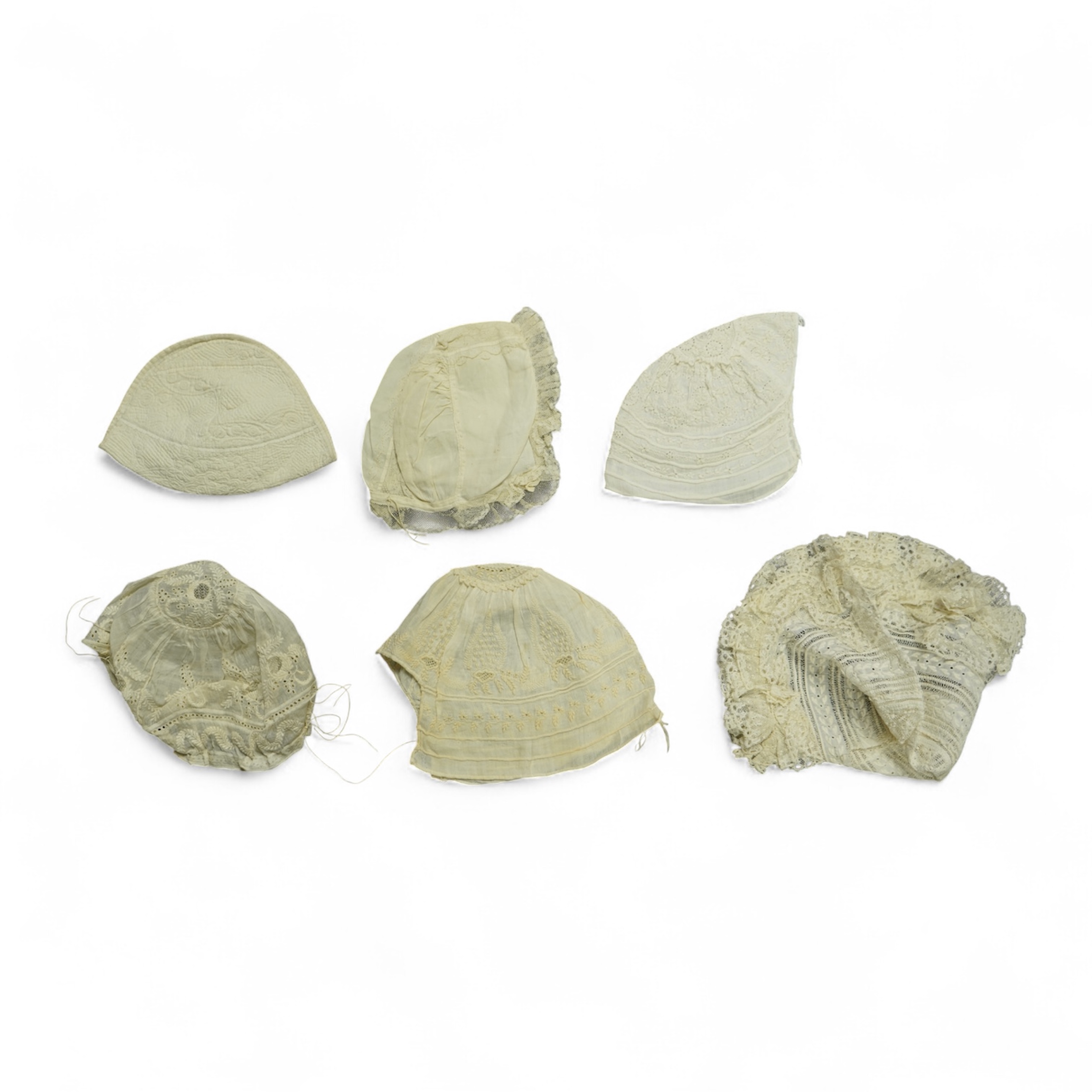 A collection of six baby’s bonnets from the mid 18th century to the late 19th century. An 18th century Hollie Point inserted baby bonnet, a quilted 18th century baby bonnet, two white work bonnets with needle lace crown